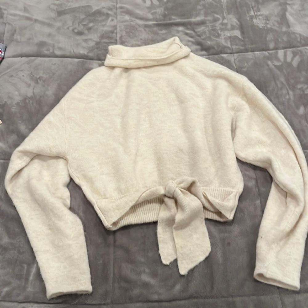White Aritzia sweater with tie in front